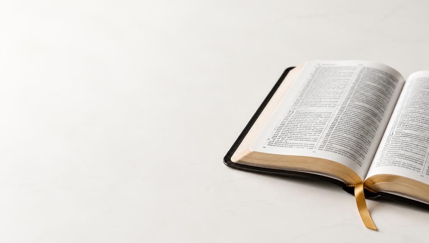 An open Bible with a gold ribbon bookmark